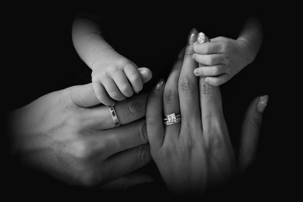 Collaborative Divorce- Baby holding parents' hands